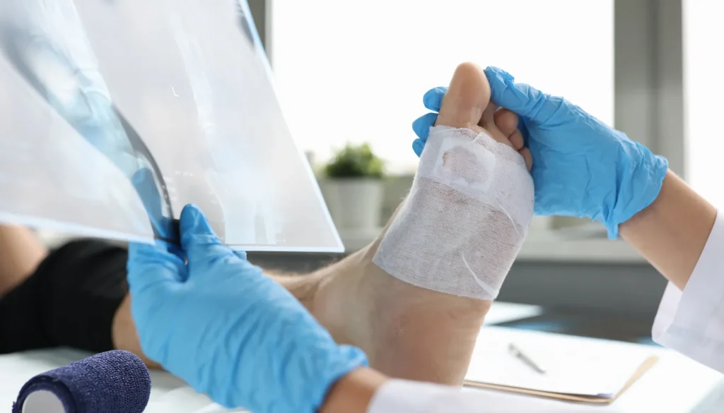 Podiatrist assessing patient's foot to determine if foot surgery is needed